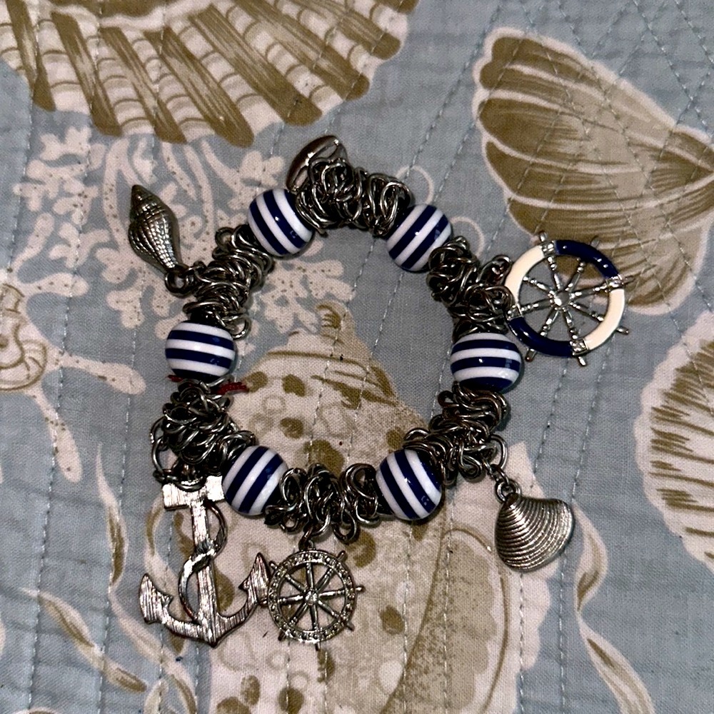 Navy blue striped beads with sailing charms anchor steering wheel clam shell